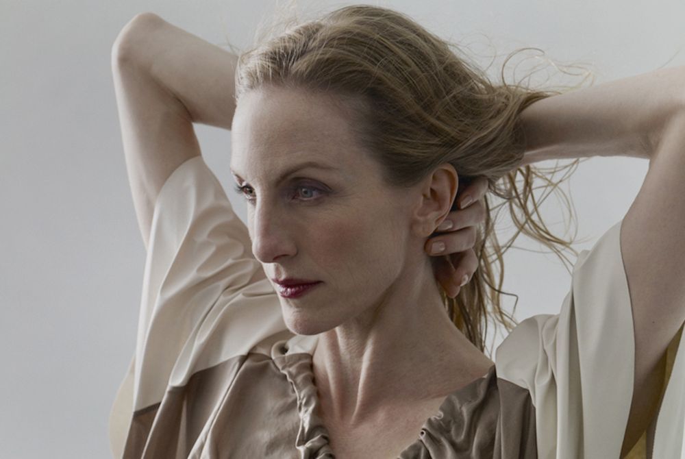 Image of Wendy Whelan with her arms behind her neck. 