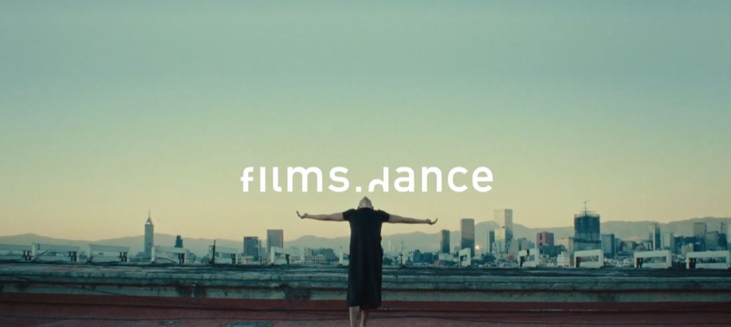 films.dance. Dancer dressed in black extending their arms out.